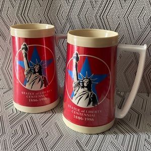 Pair of two Statue of Liberty thermal mugs
